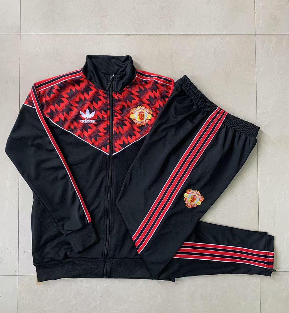 Manchester United 25/26 Chaqueta Niño · Negro · Estampado · Parte Superior Rojo