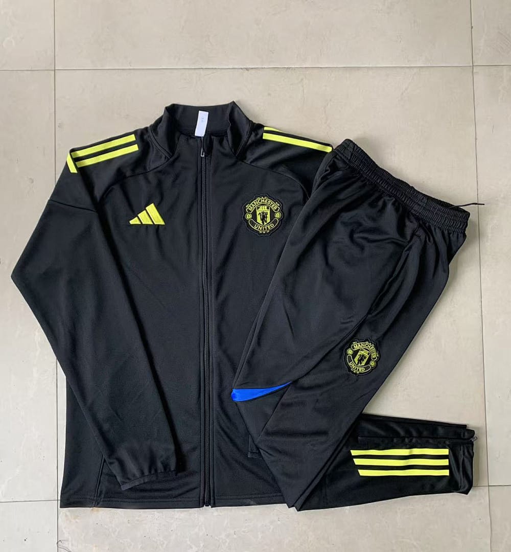 Manchester United 25/26 Chaqueta Niño · Negro · Logo Verde