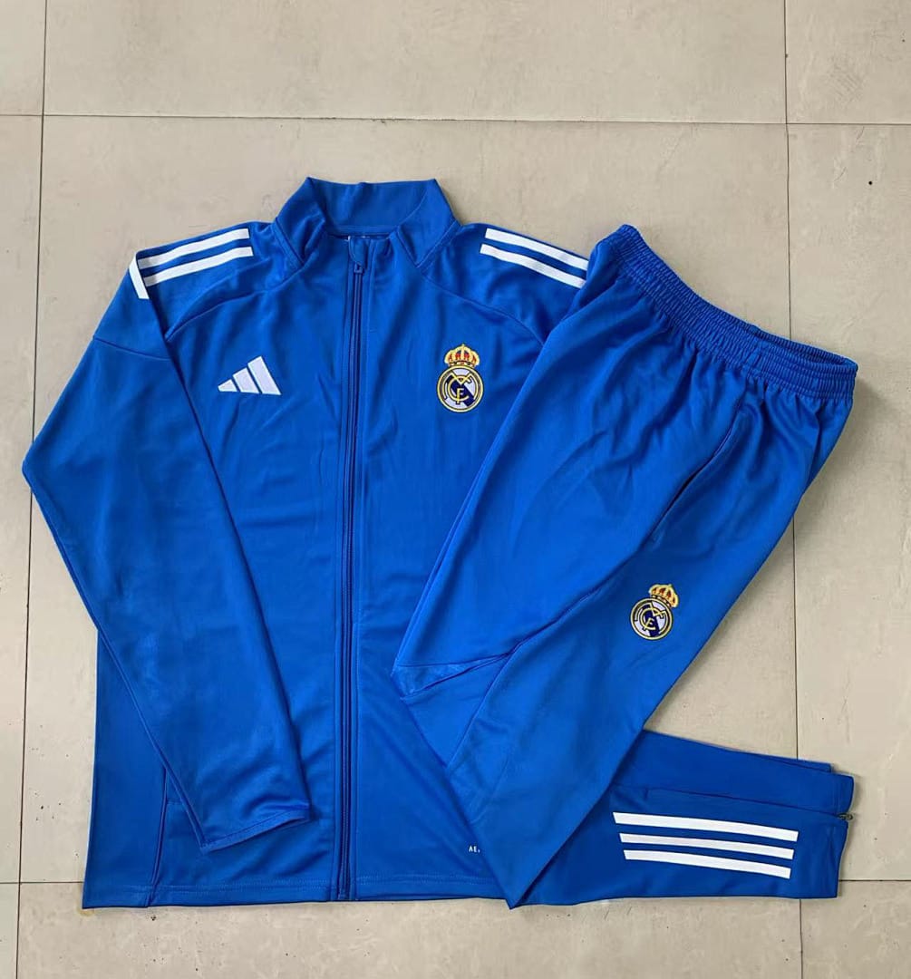 Real Madrid 25/26 Chaqueta Niño · Celeste · Tres Rayas Blanco