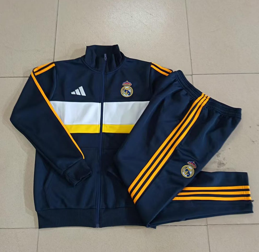 Real Madrid 26/27 Chaqueta Niño · Azul Marino · Detalles Blanco y Amarillo