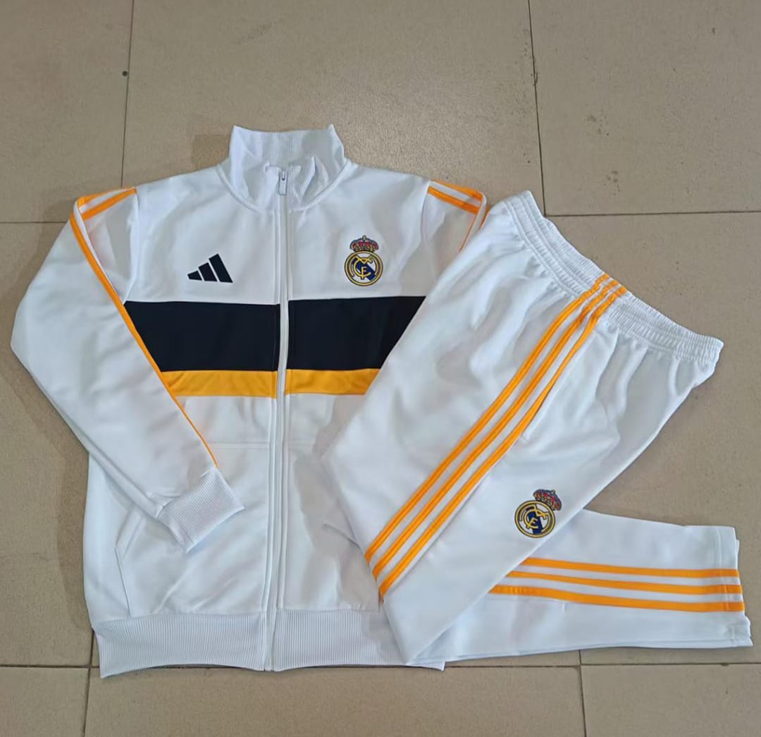Real Madrid 26/27 Chaqueta Niño · Blanco · Detalles Azul Marino y Amarillo